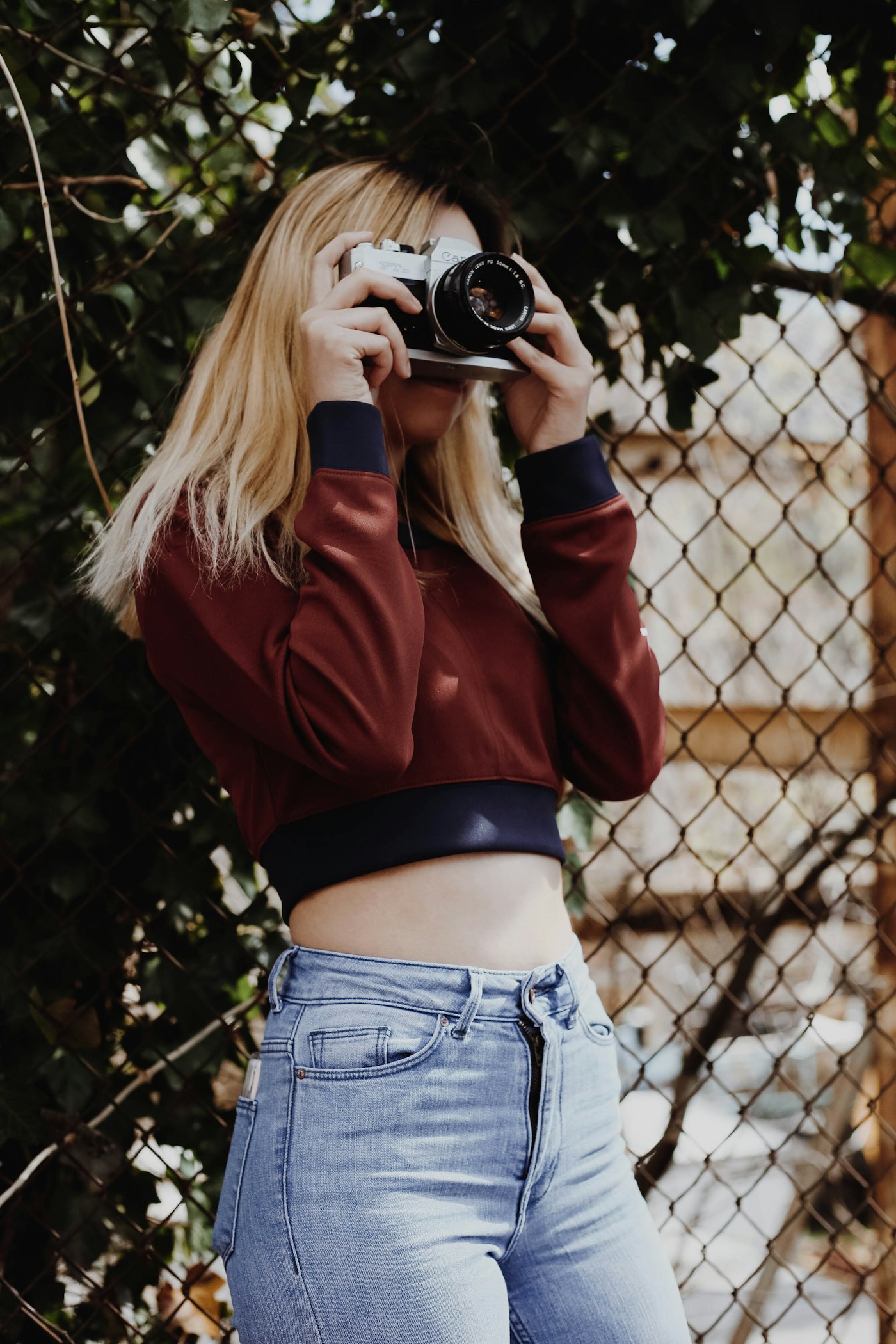 A creator looking through her camera